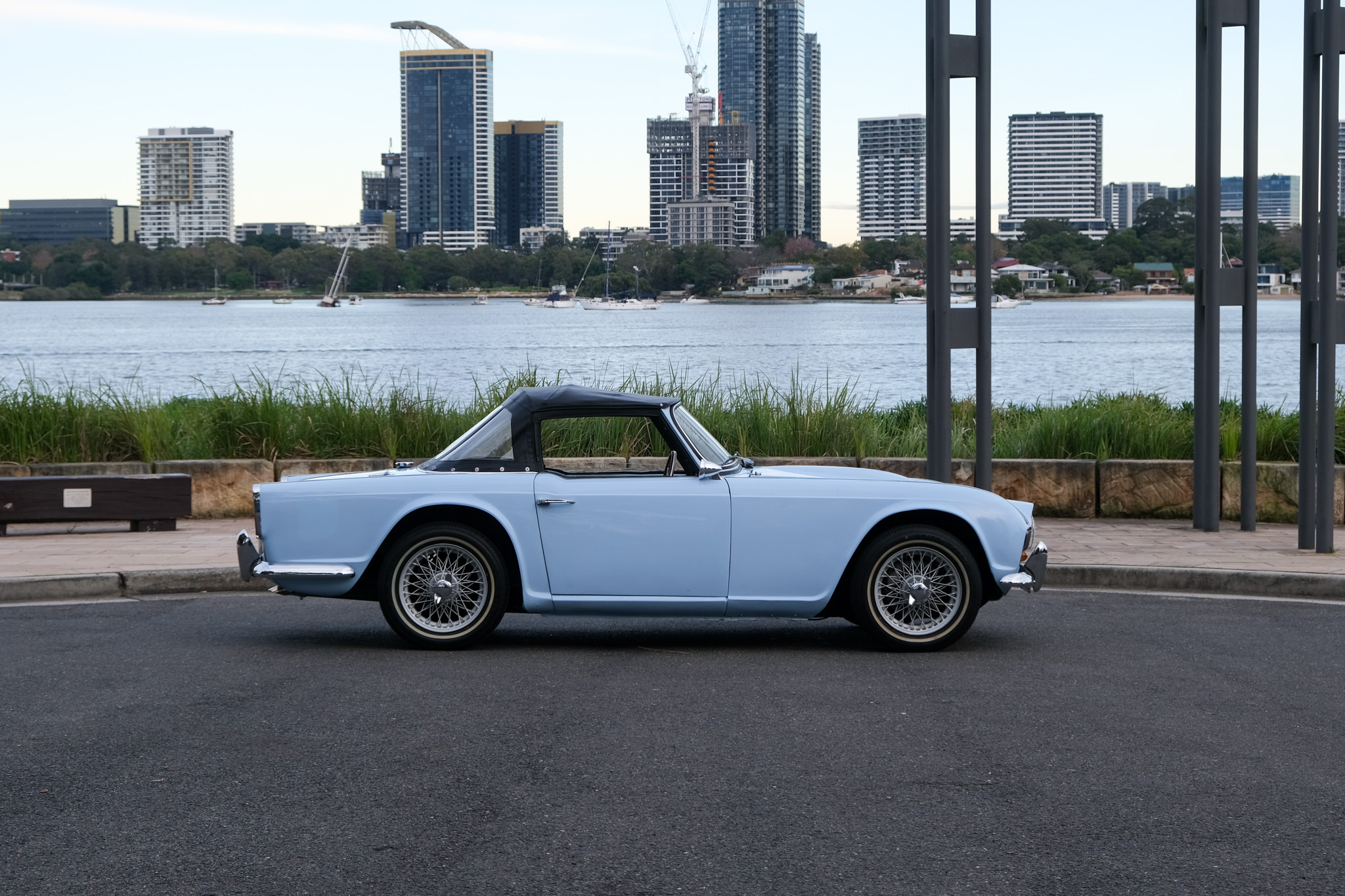 Triumph TR4 side profile with Sydney skyline